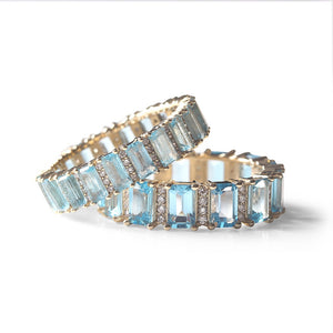 BLUE TOPAZ AND DIAMOND  EMERALD CUT ETERNITY RING